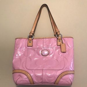 A large patent brand new pink Coach purse.
